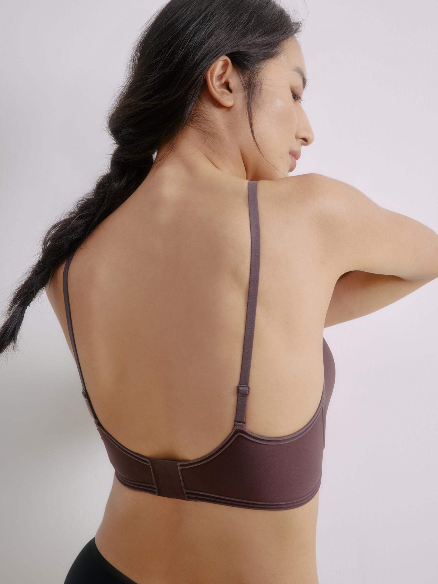 Back view of woman wearing brown bra