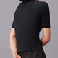 The side back of a woman wearing black round neck T-shirt.