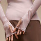 Close up of light pink long sleeve top.