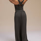 Back view of model wearing black wide leg pants and dance top