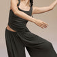 Model wearing black Modal Pleated Dance Tank Top and wide leg pants