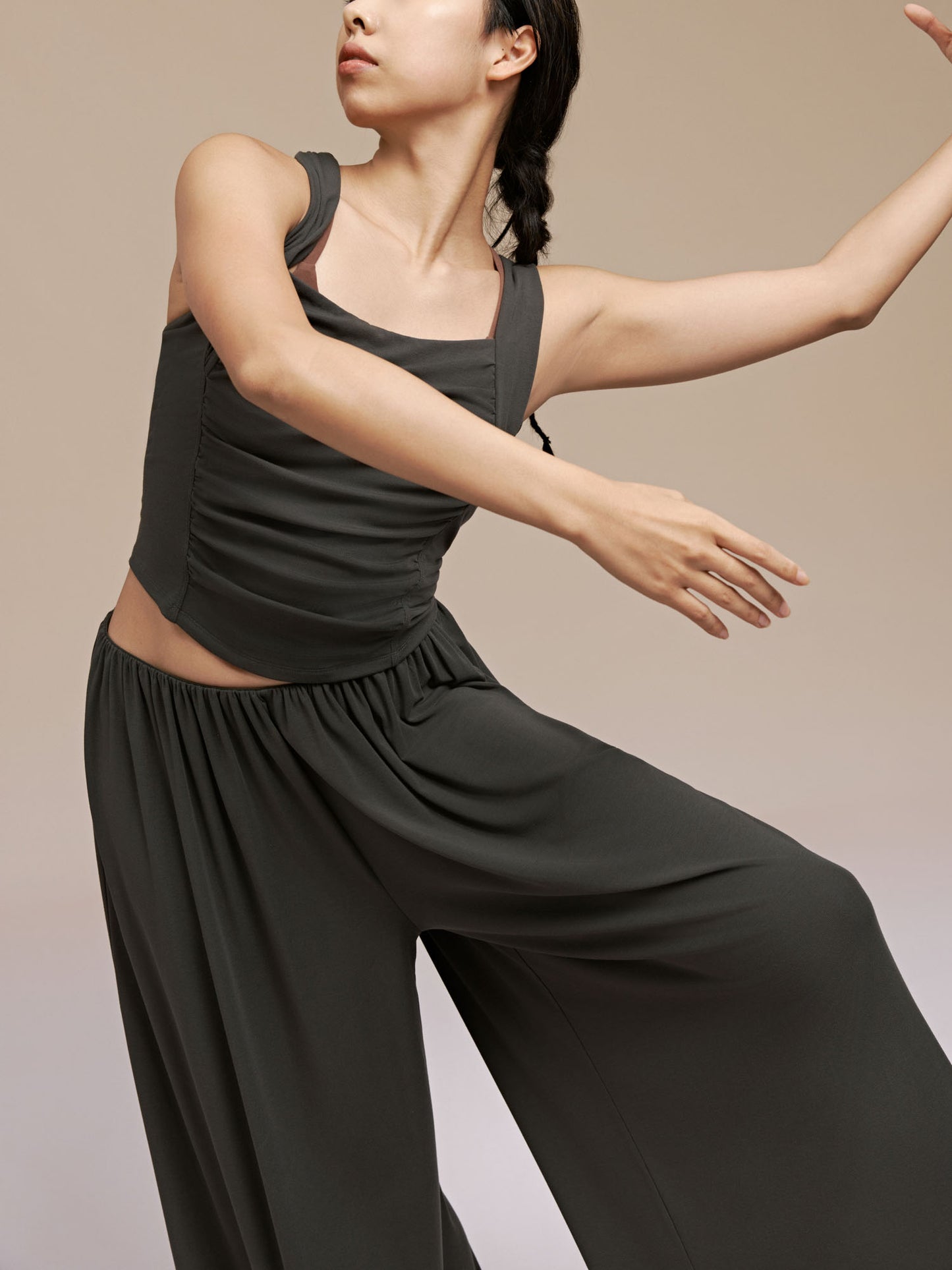 Model wearing black Modal Pleated Dance Tank Top and wide leg pants