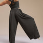 Back side of model wearing black wide leg pants and top