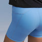 Closeup of light blue biker shorts pockets 