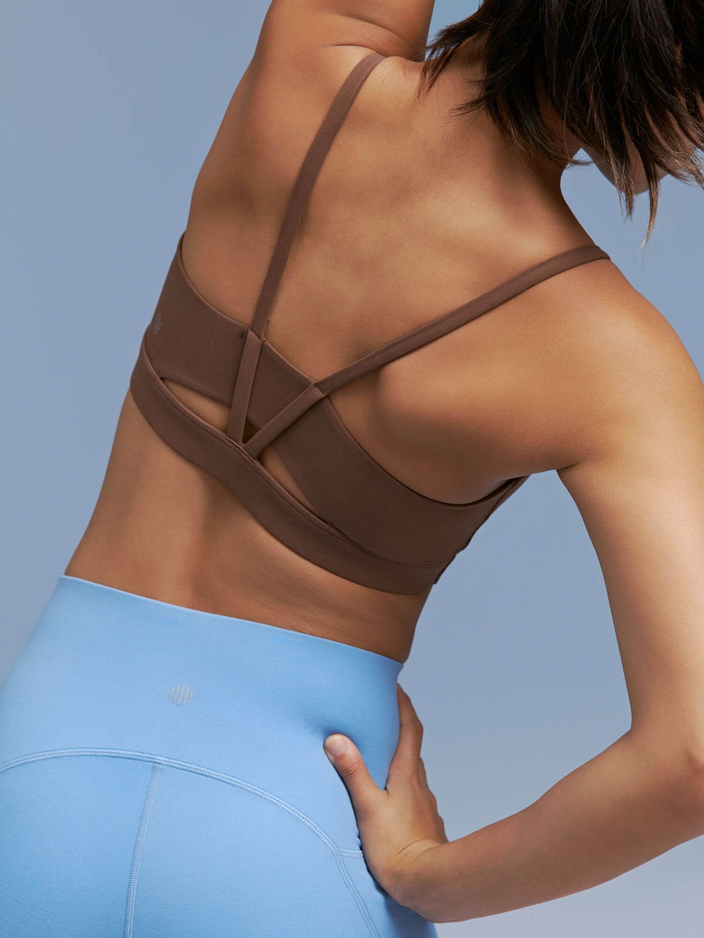 Closeup detail of back side of brown sports bra