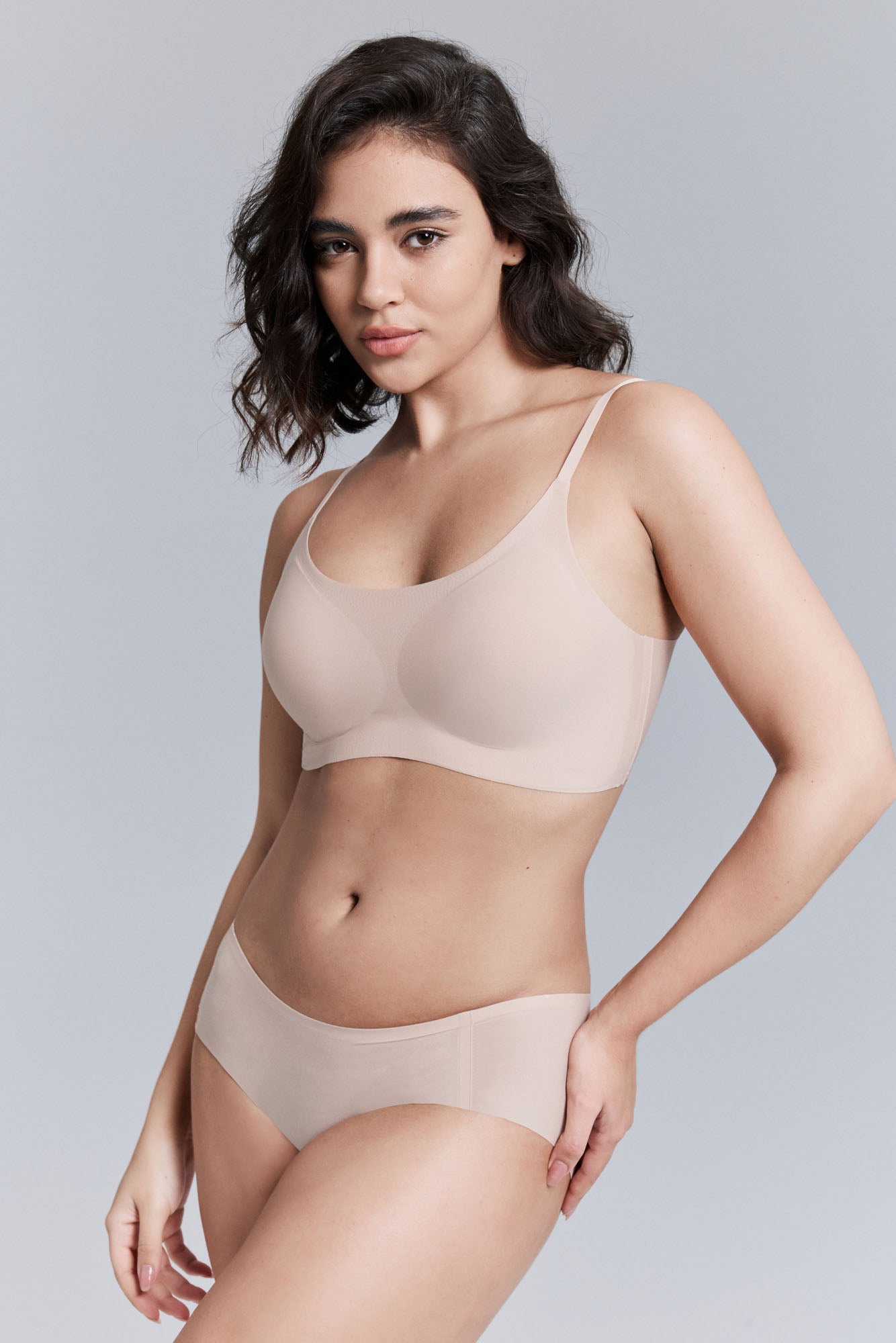 Model wearing nude bra and brief set.