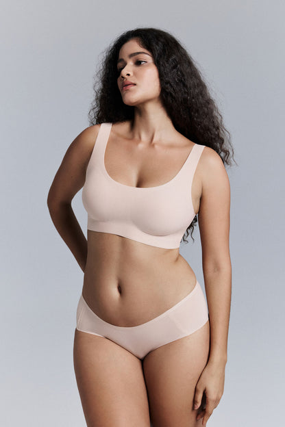 Model wearing nude bra and brief set.