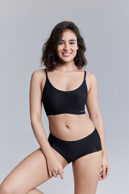 Model wearing black bra and brief set.