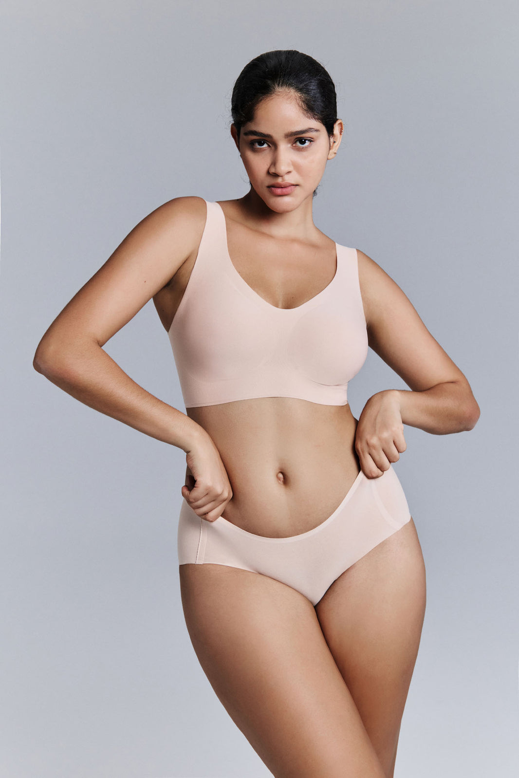 Model wearing nude bra and brief set