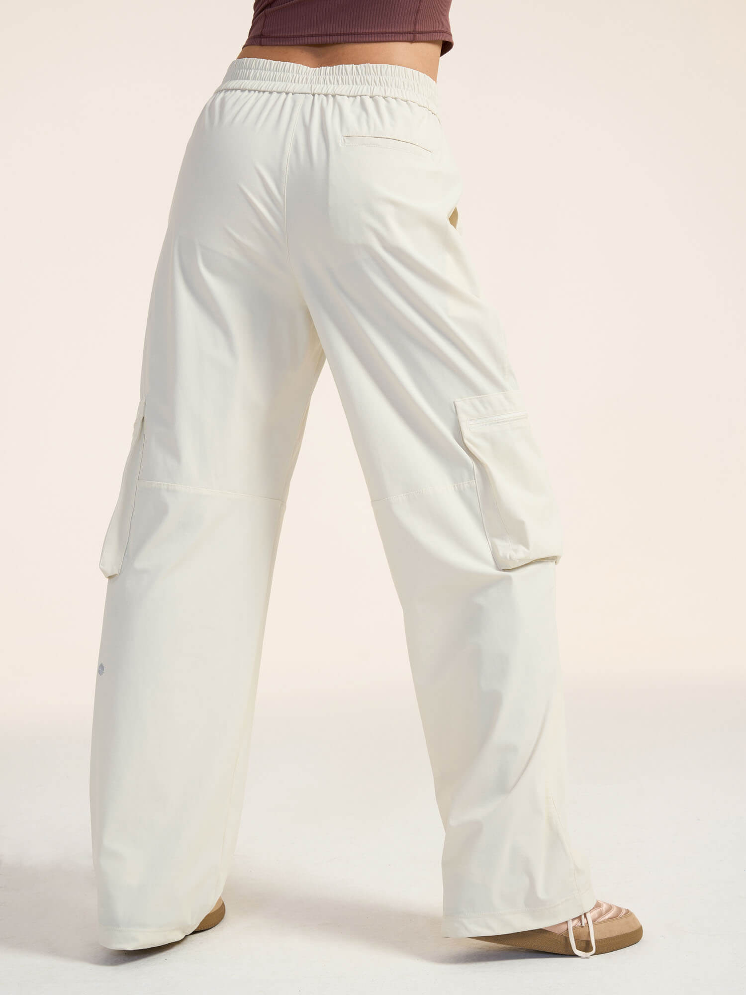 Model wearing white wide-leg cargo pants 