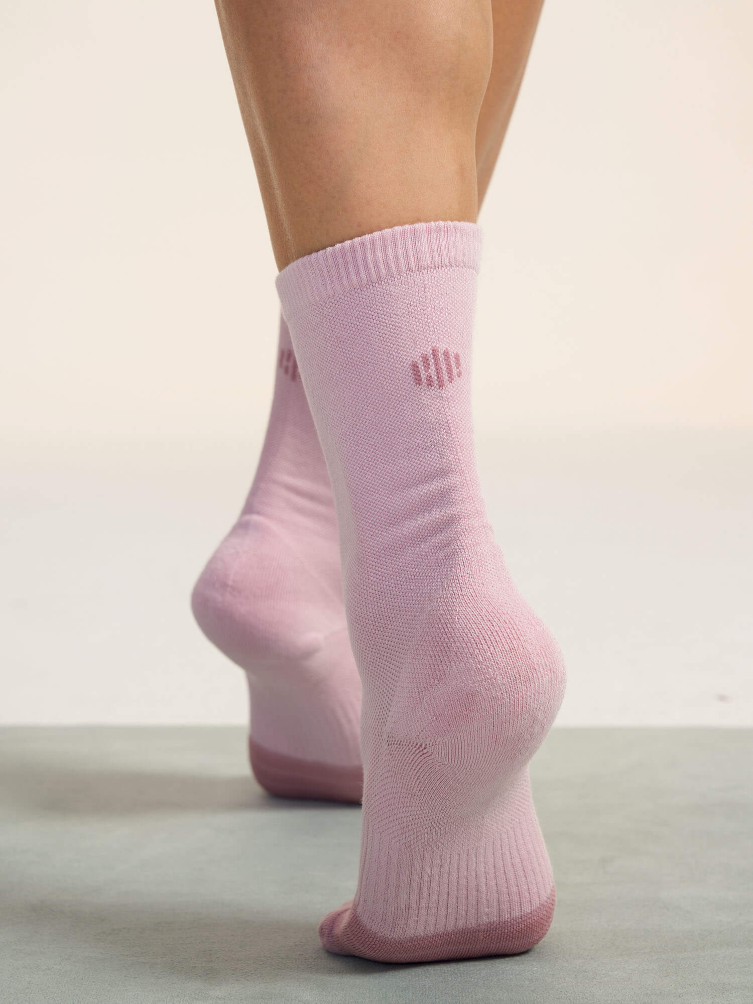 Model wearing light pink socks