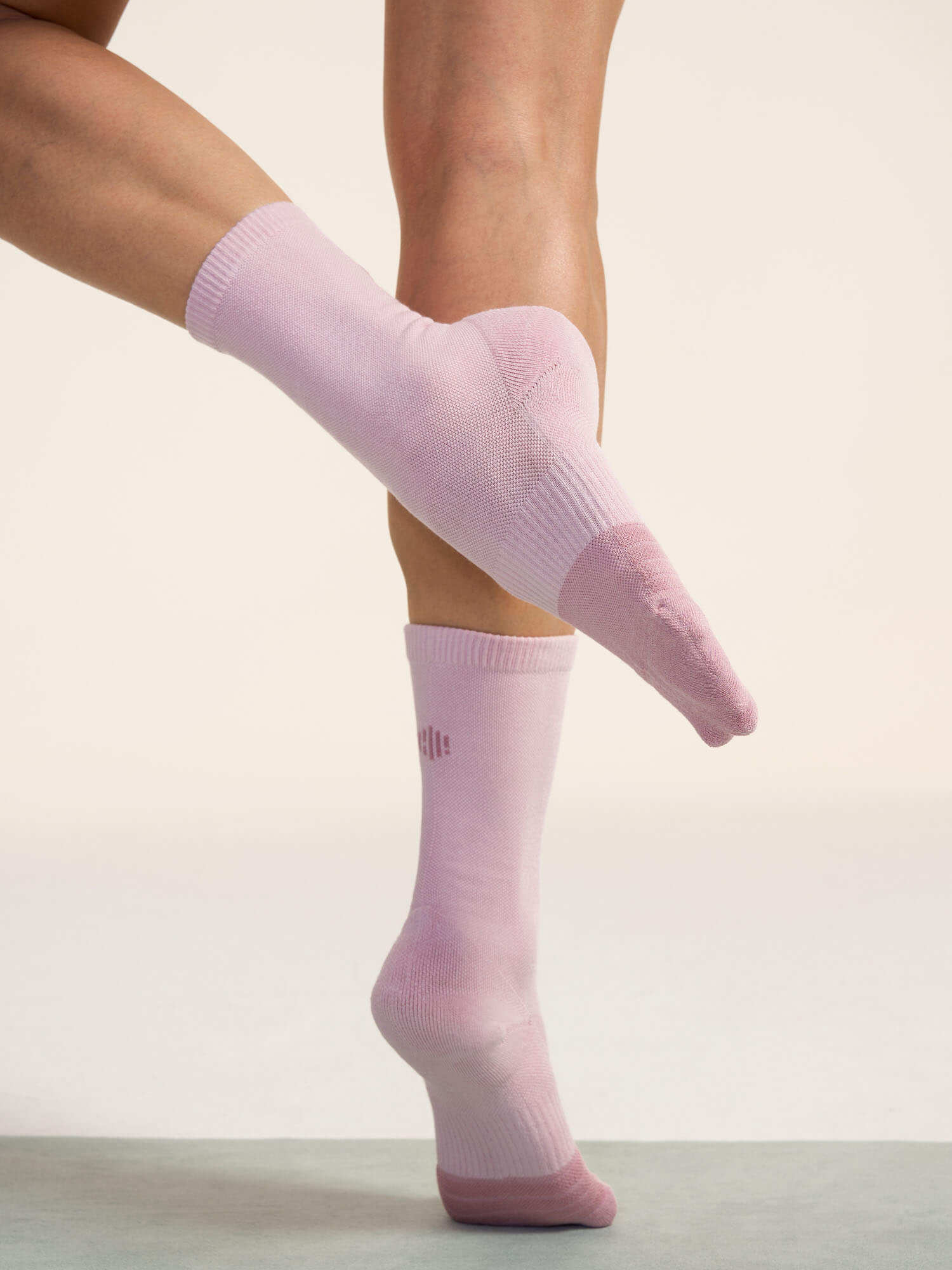 Model wearing light pink socks