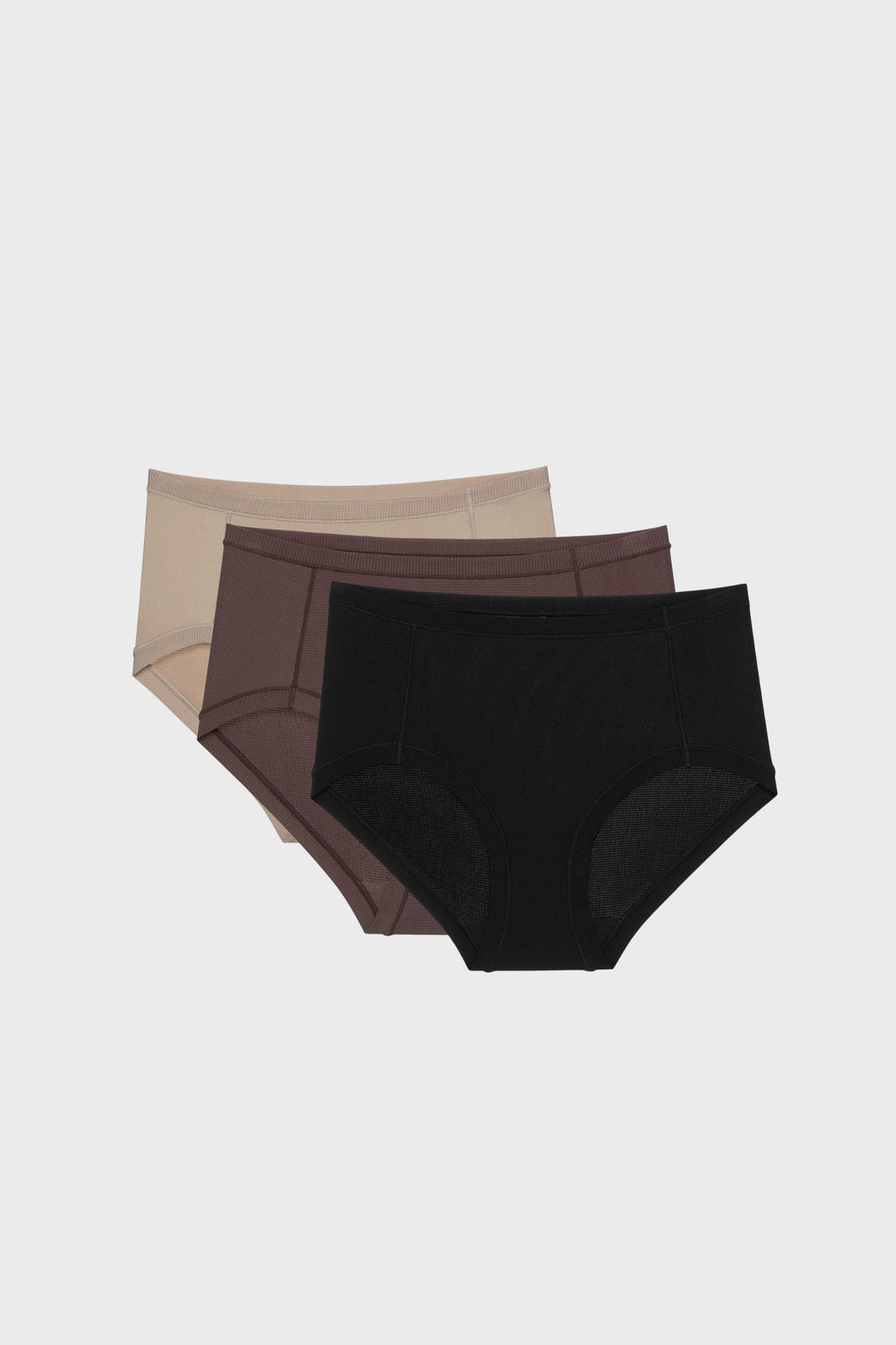 three briefs in tan, dark purple, and black