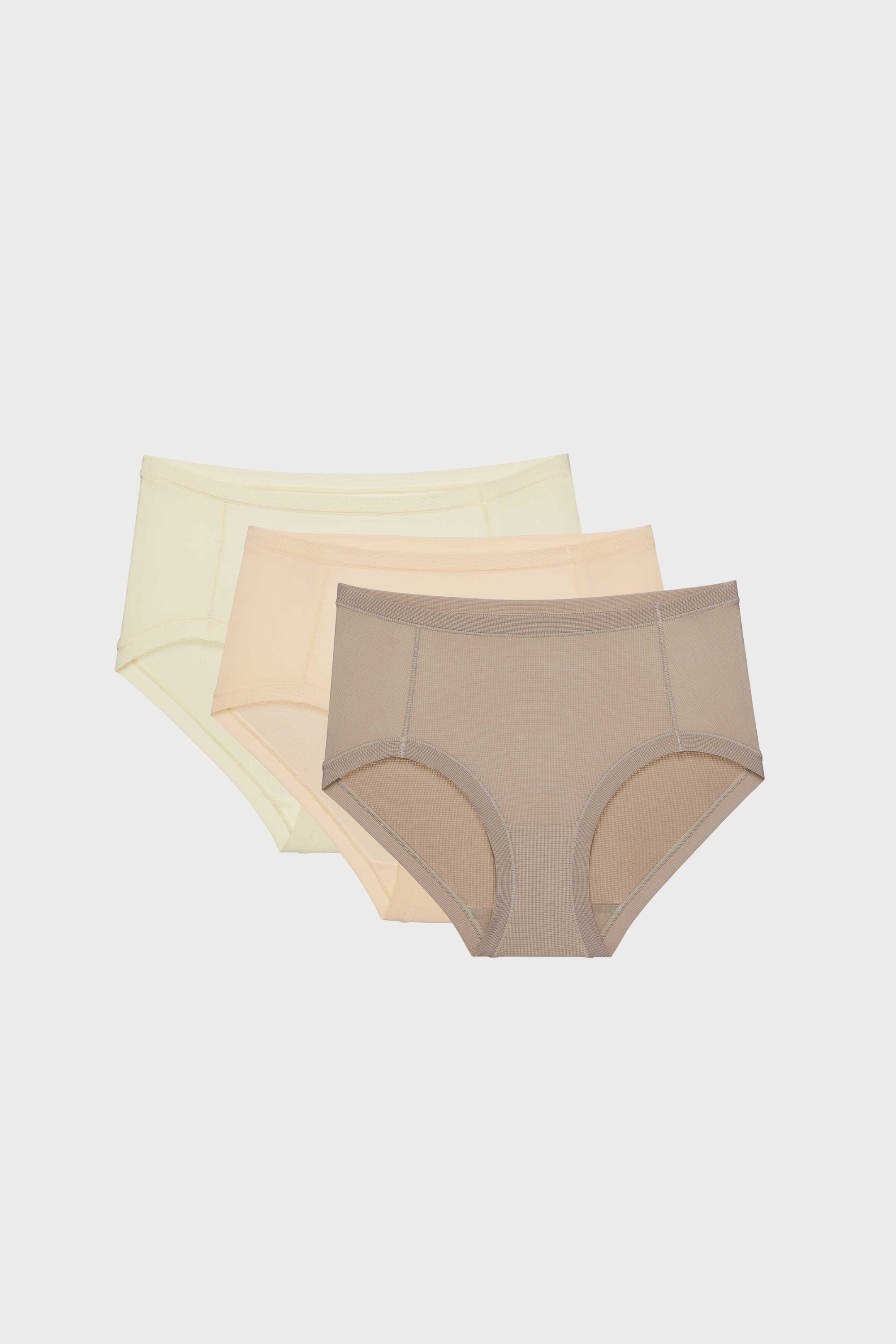 three briefs in cream, beige, and tan