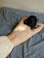 Model wearing a beige bra.  Treacly Almond color.