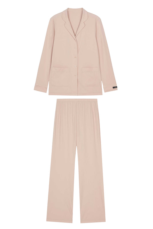flat lay of pink button up pajama top and pants
