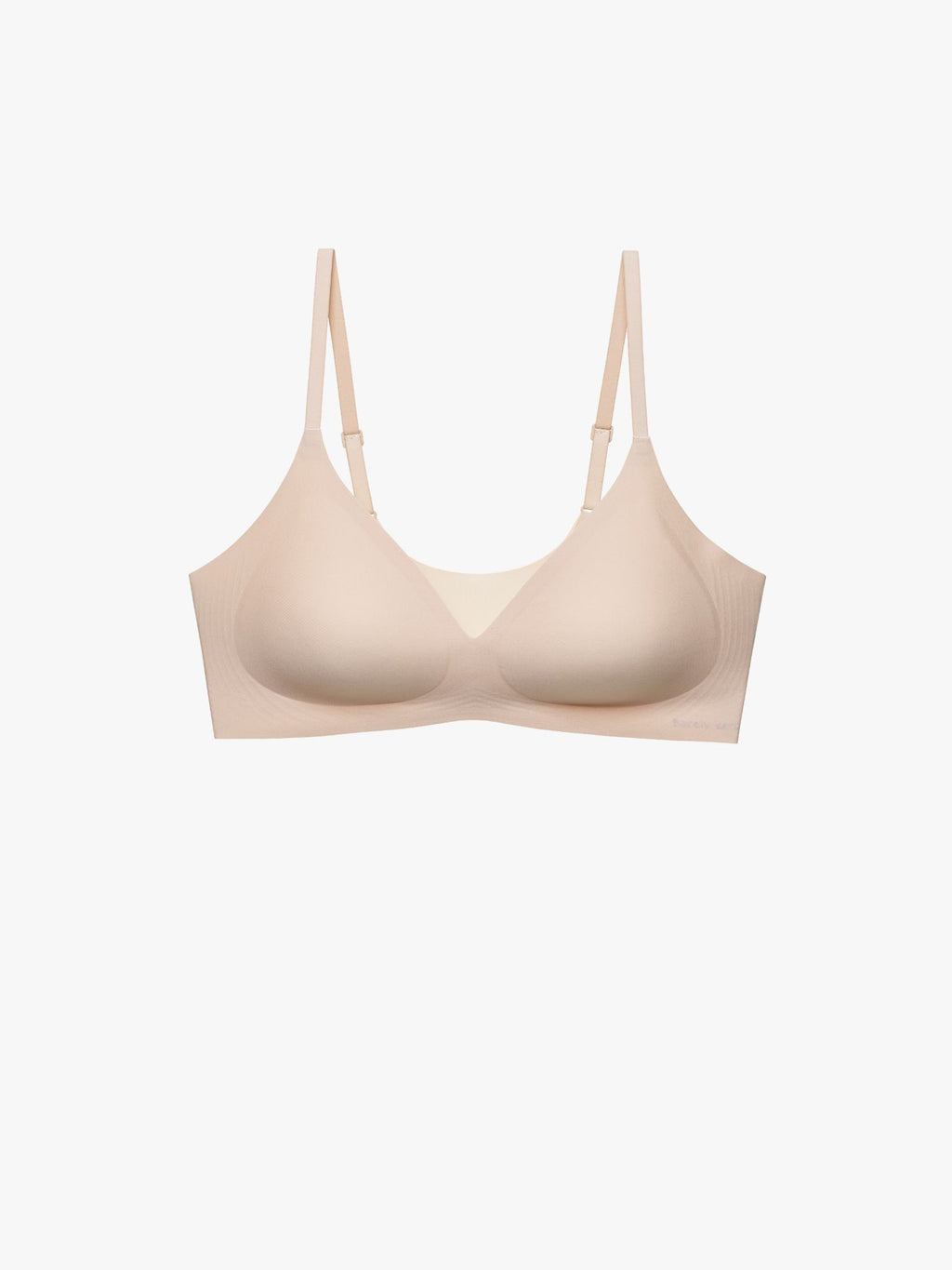A light beige wireless underwire bra with adjustable shoulder straps, shown against a plain white background. Treacly Almond