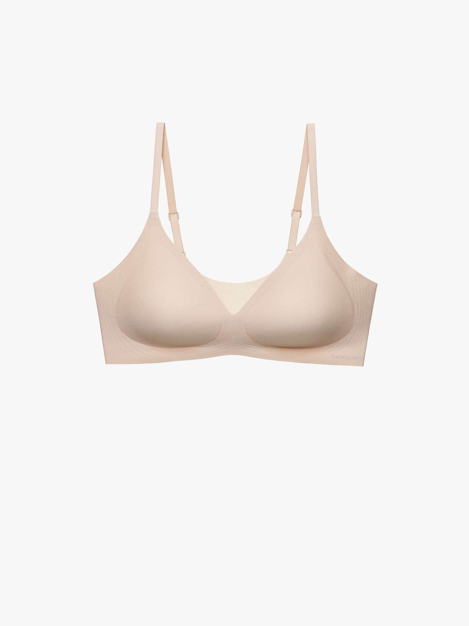 A light beige wireless underwire bra with adjustable shoulder straps, shown against a plain white background. Treacly Almond