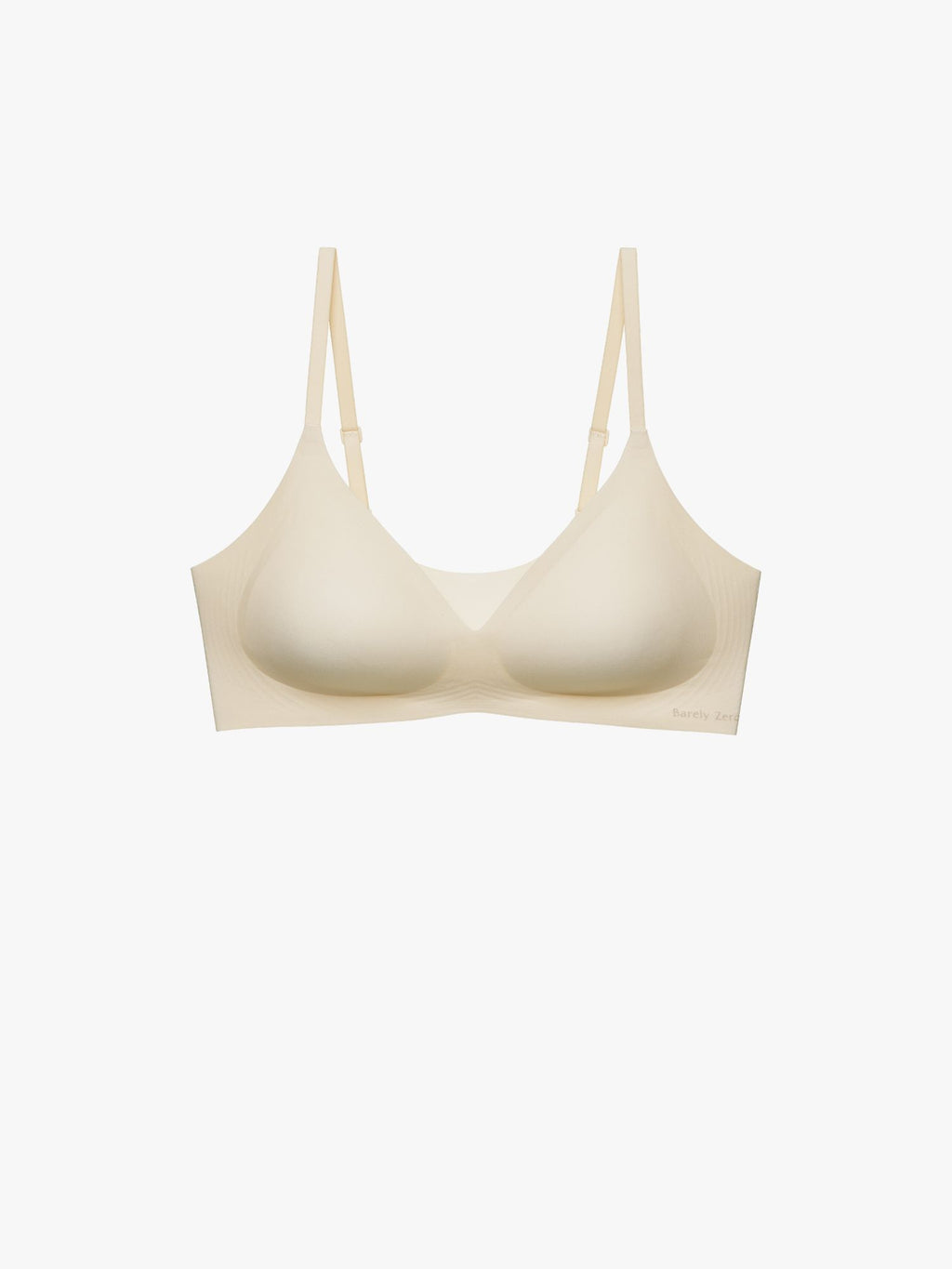 A light beige wireless bra with a wide, comfortable band and thin adjustable shoulder straps, shown against a plain white background. Eggwhite