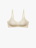 A light beige wireless bra with a wide, comfortable band and thin adjustable shoulder straps, shown against a plain white background. Eggwhite