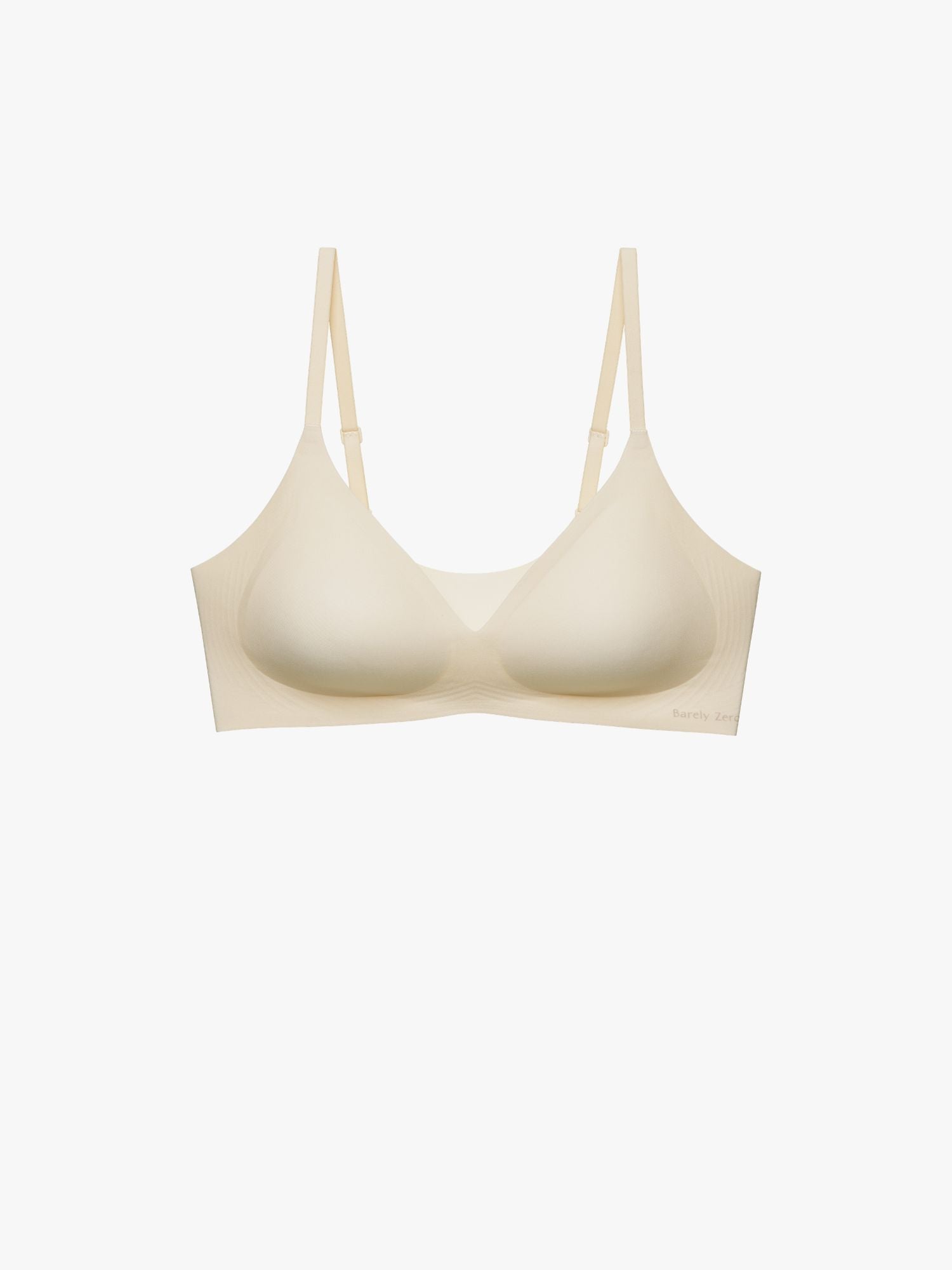 A light beige wireless bra with a wide, comfortable band and thin adjustable shoulder straps, shown against a plain white background. Eggwhite