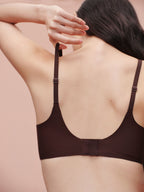Back view of model wearing brown bra.