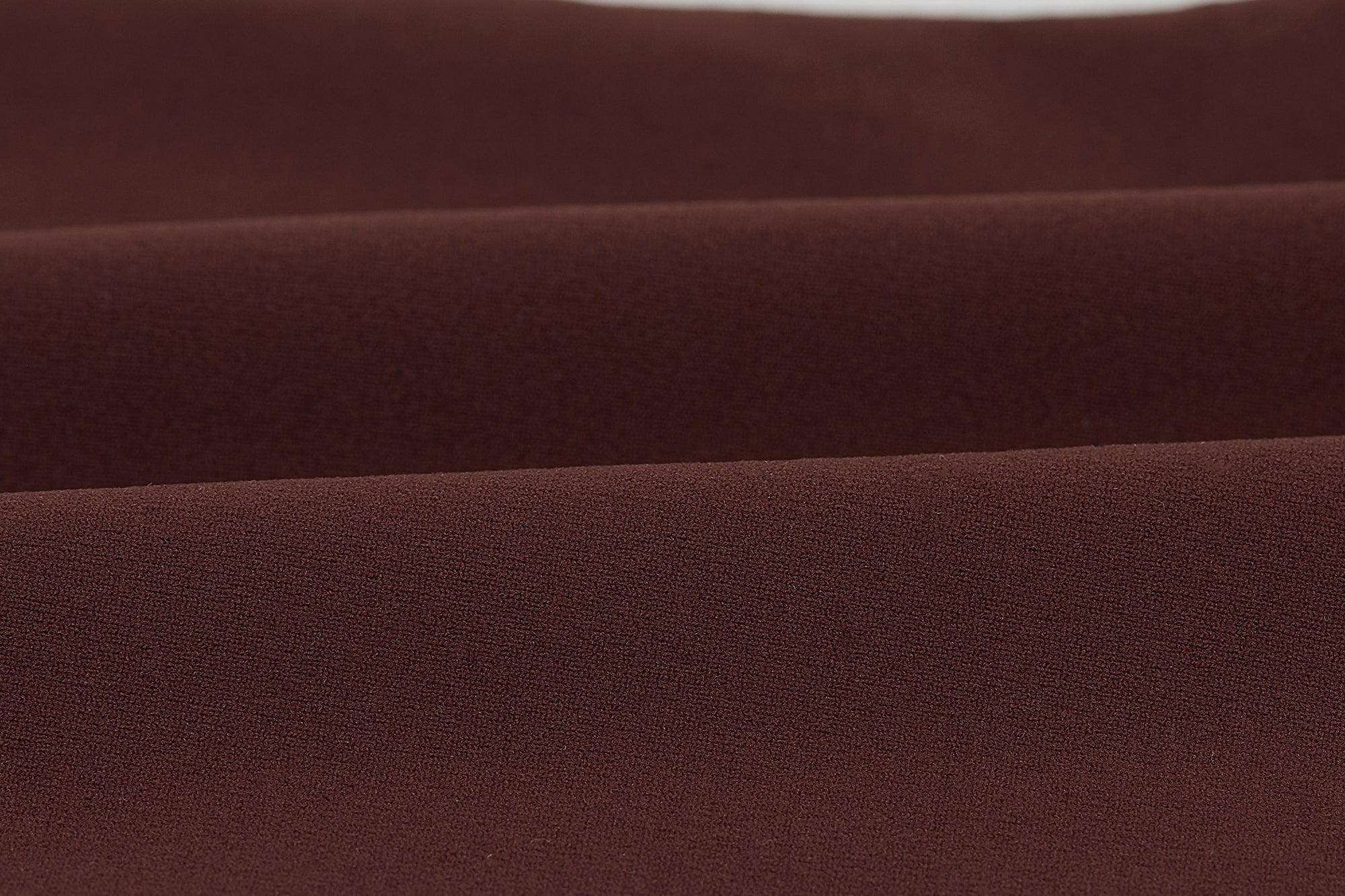 Close-up of brown fabric with a subtle texture