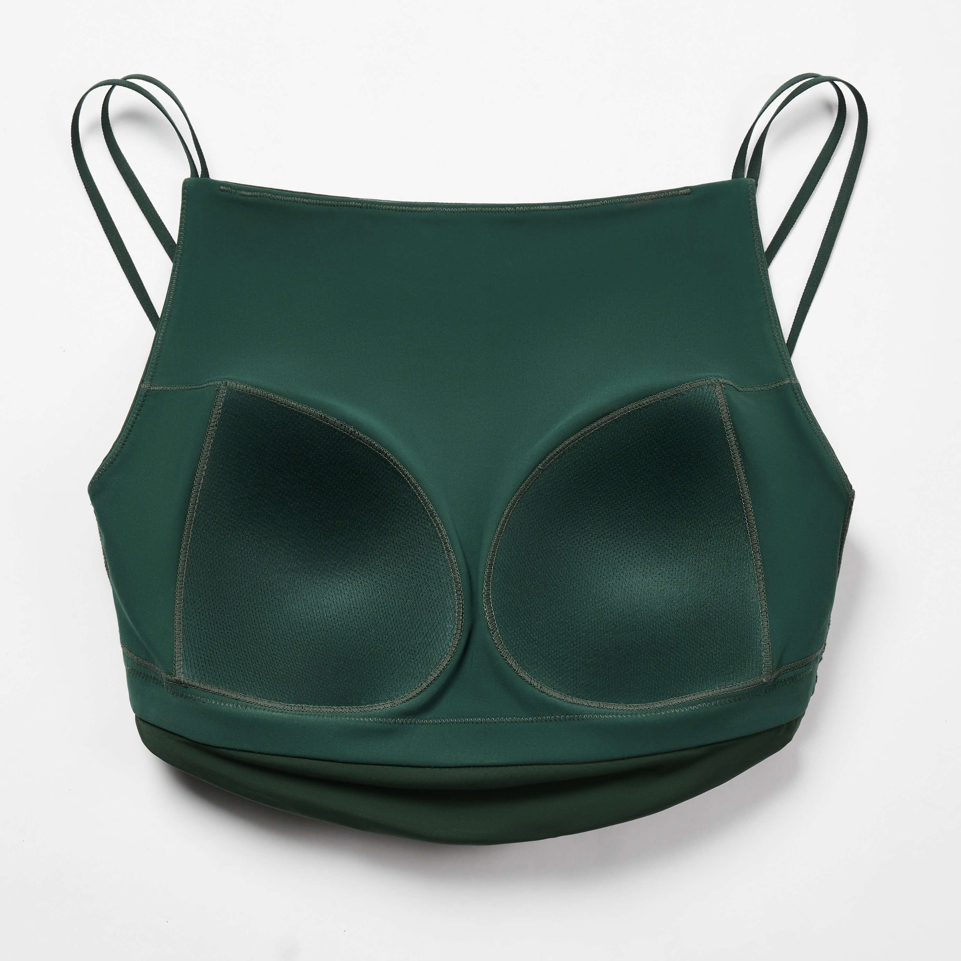 The inside of dark green sports bra with sew-in bra pads