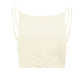 a flat lay of a white sports bra with crew neck, double shoulder straps and pleat details