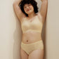 woman wearing light yellow bra and matching panties