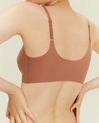 Woman wearing cinnamon color spaghetti strap bra. Cinnamon Taste color.