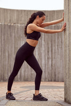 woman in black sports bra and leggings