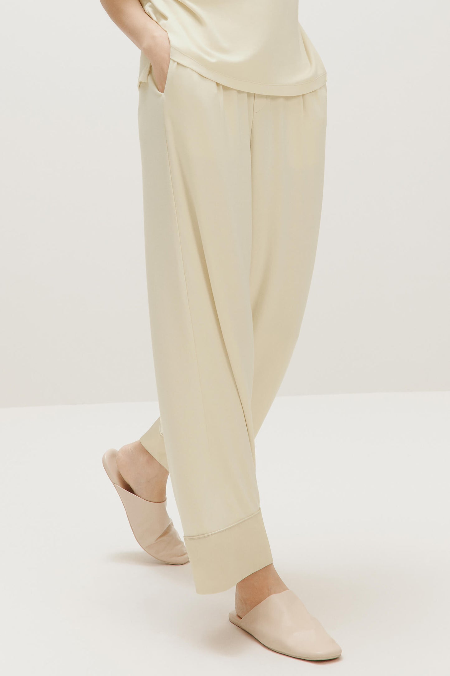 woman in cream color pajama pants