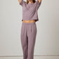 woman in purple pajama t-shirt and matching pants
