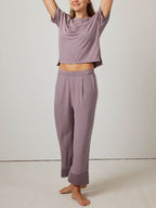 woman in purple pajama t-shirt and matching pants