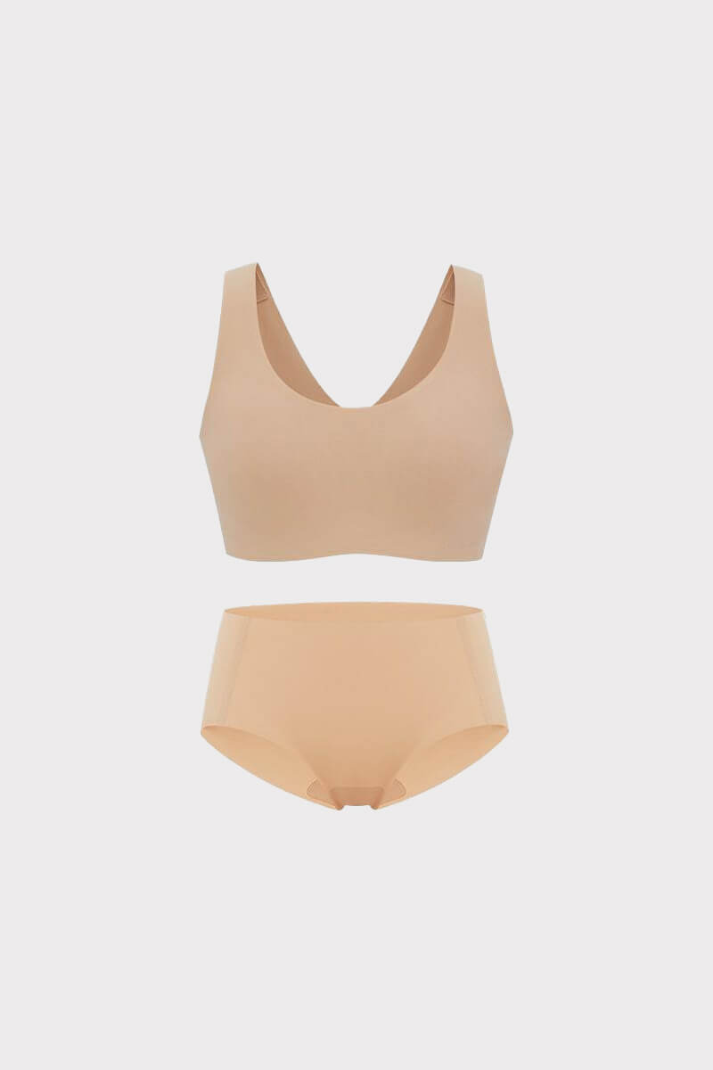 A beige Barely Zero Classic Bra and matching Mid-Waist Brief set displayed against a soft gray background.