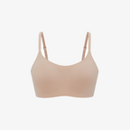 The Barely Zero Spaghetti Strap Bra - TikTok features a nude color, CloudFit comfort, and adjustable thin straps—making it the perfect everyday bra. Displayed on a plain white background.