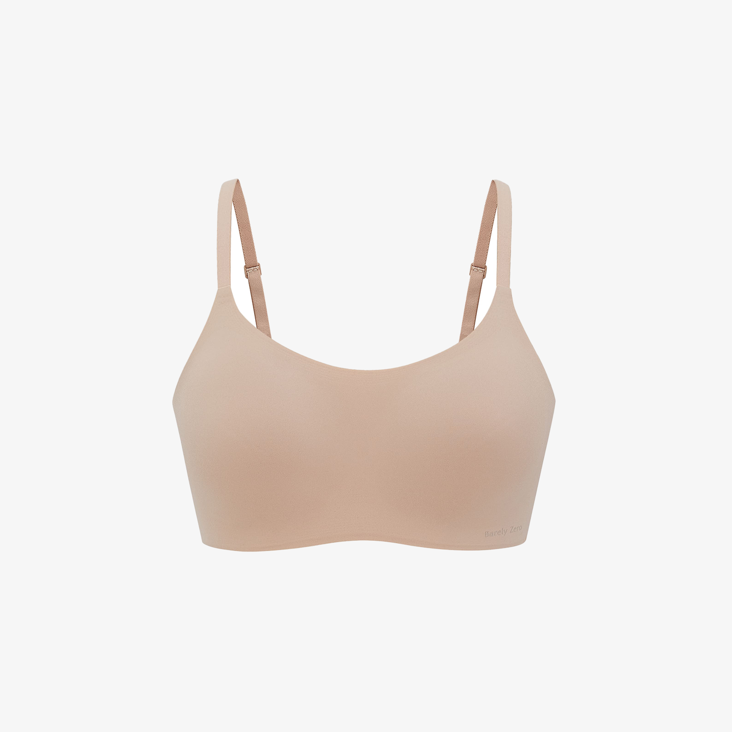 The Barely Zero Spaghetti Strap Bra - TikTok features a nude color, CloudFit comfort, and adjustable thin straps—making it the perfect everyday bra. Displayed on a plain white background.