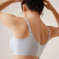 Back view of woman wearing light blue bra