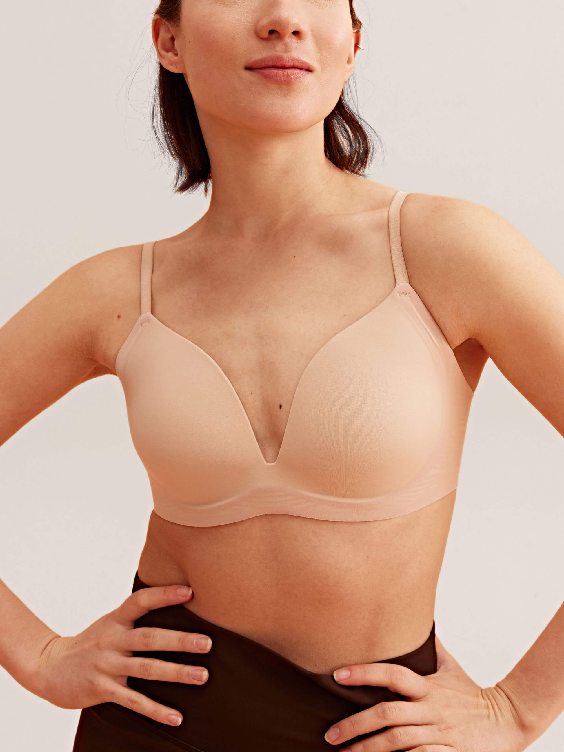 Front view of model wearing nude bra 