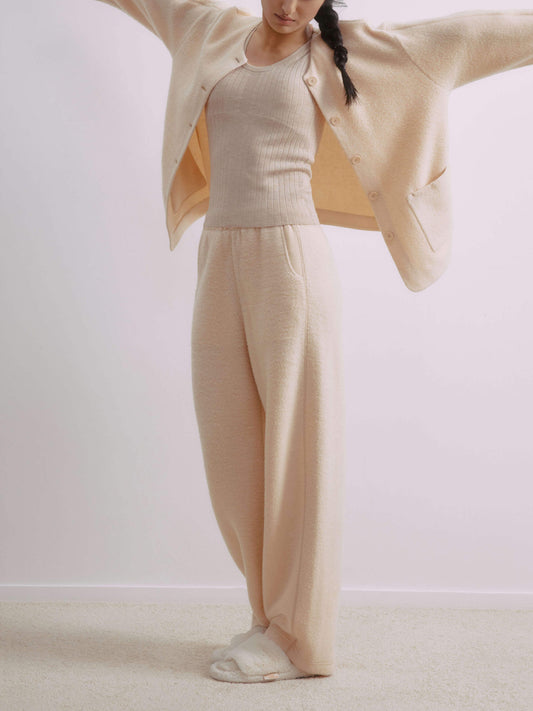 Front view of woman wearing wool fleece pants