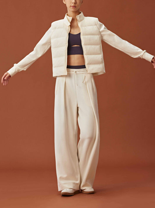 Front view of woman wearing white cropped jacket