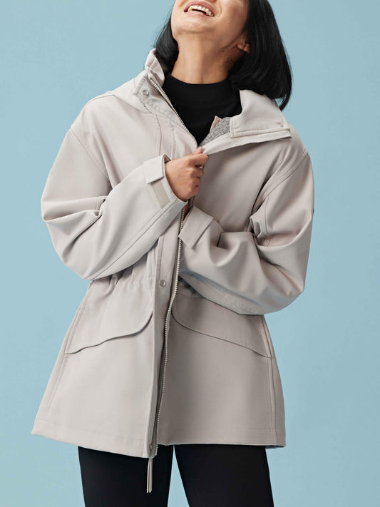 Woman wearing gray hooded coat