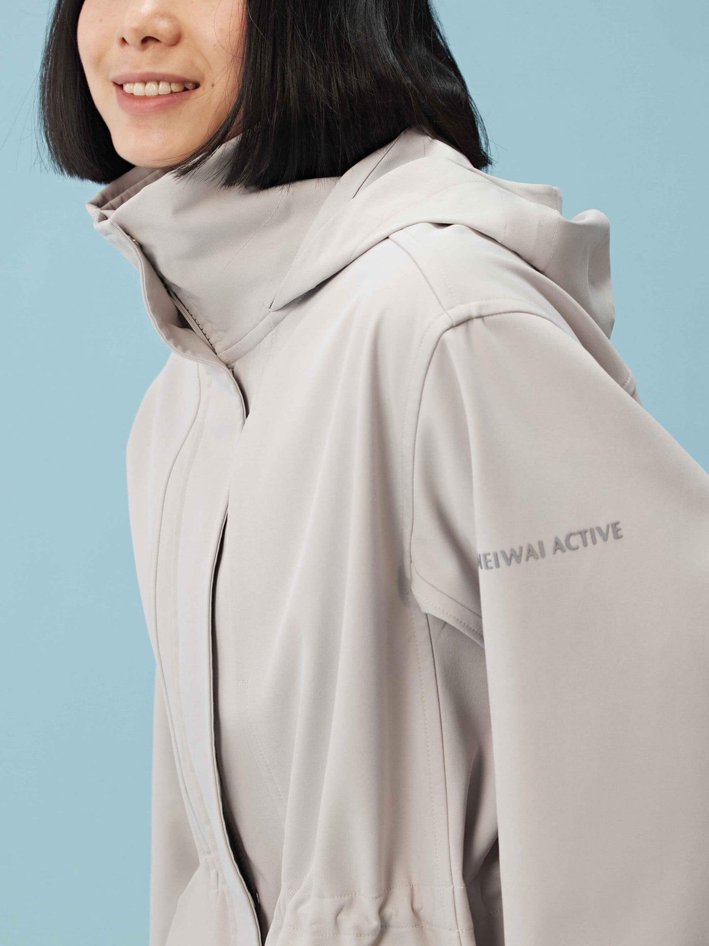 Detail view of gray hooded coat