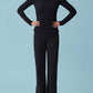 Front view of woman wearing black woven fleece pants