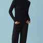 Front view of woman wearing black woven fleece pants