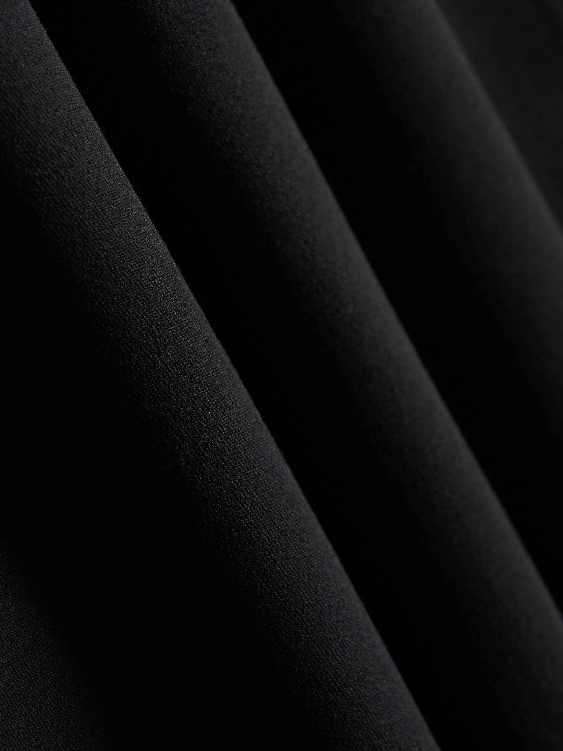 fabric detail of black leggings