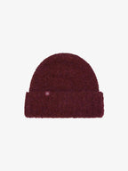 flat lay of burgundy beanie