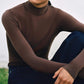 Front view of woman wearing brown wool seamless turtleneck