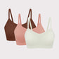 three bras in brown, pink and off white